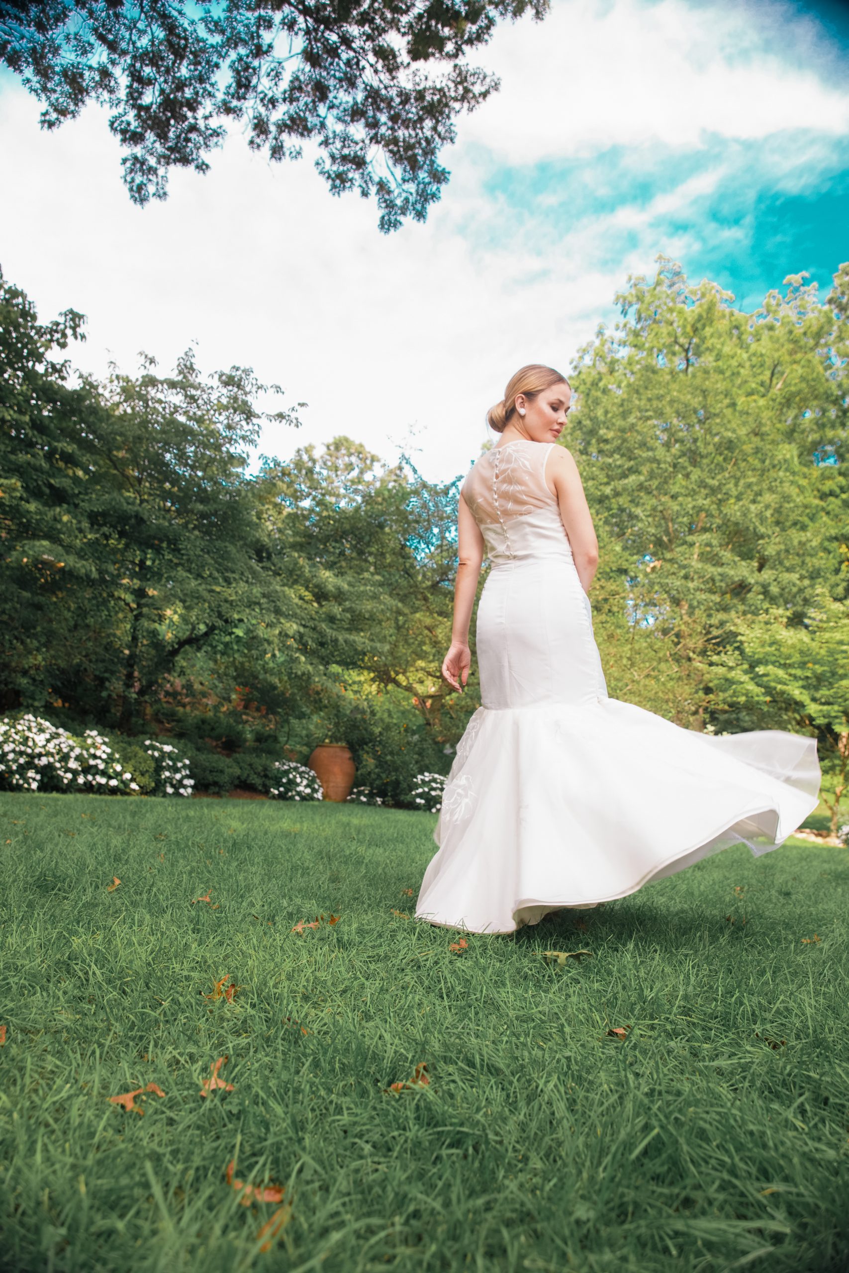 Modern trumpet bridal dress with hand painted detailing and custom back buttons