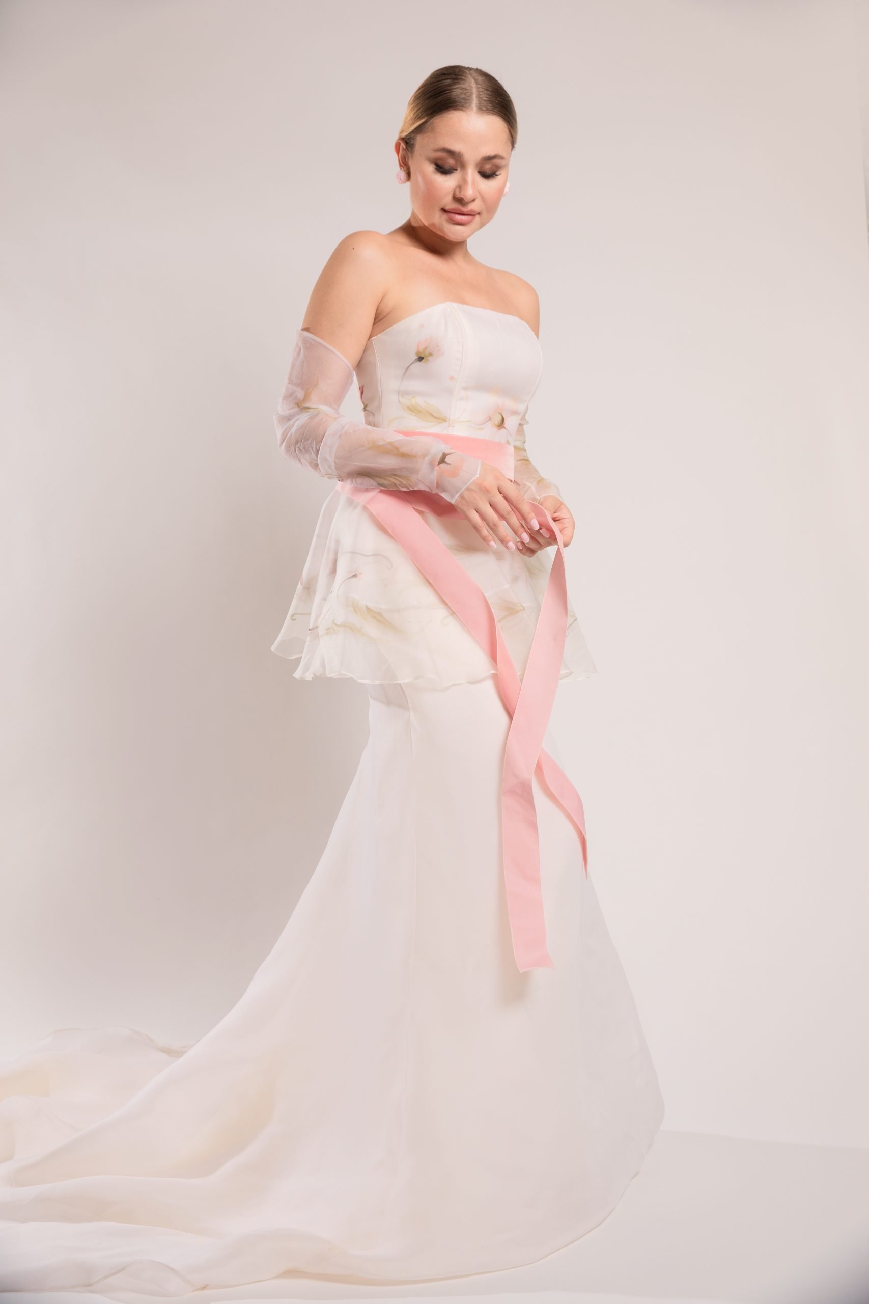 Strapless fit and flare silk wedding dress with hand painted bodice and ruffles