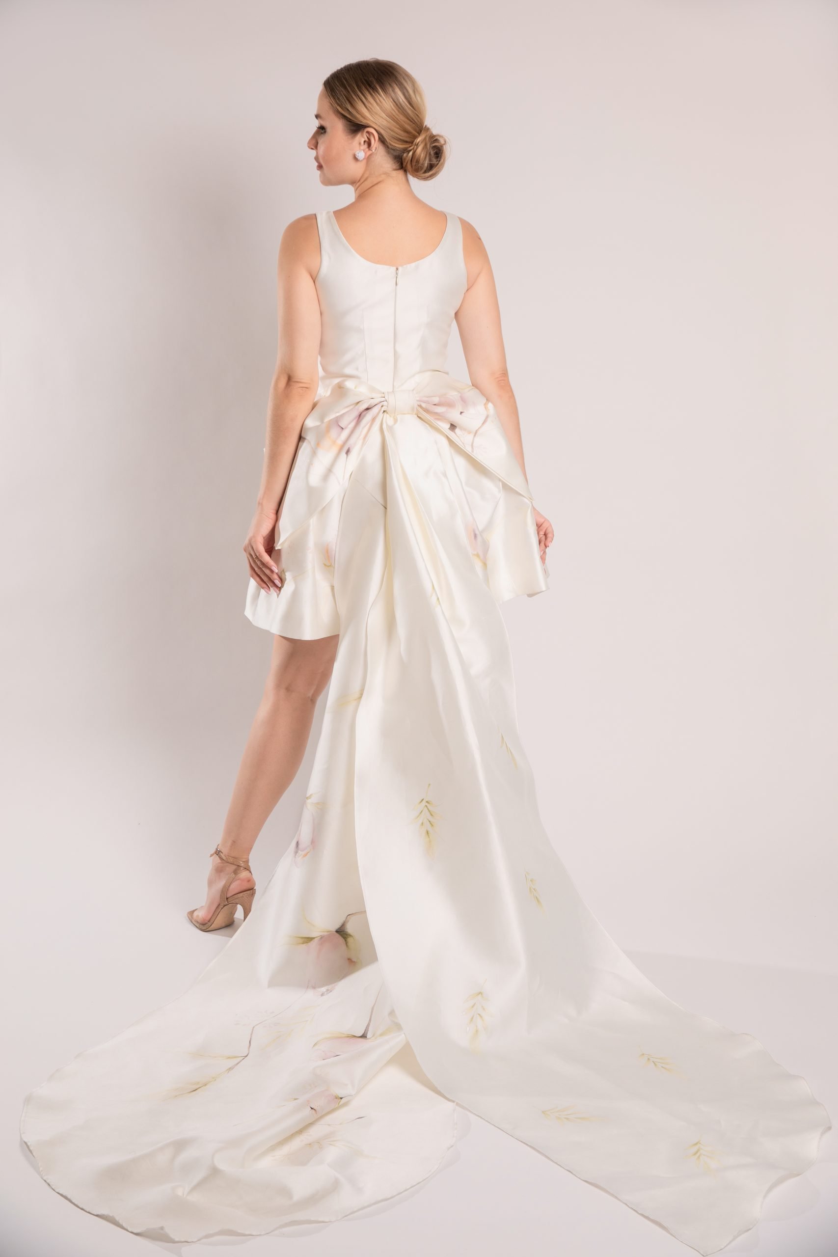 back view of Modern couture wedding mini dress with removable hand painted bow detail