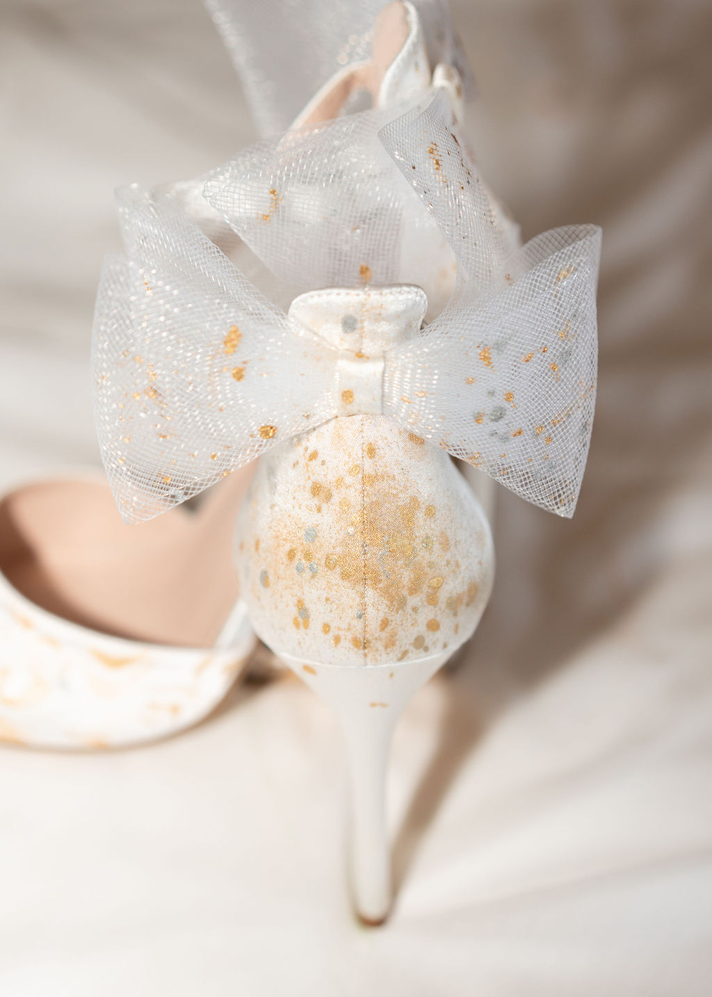 Artisan hand painted silk bridal shoes featuring metallic gold roses