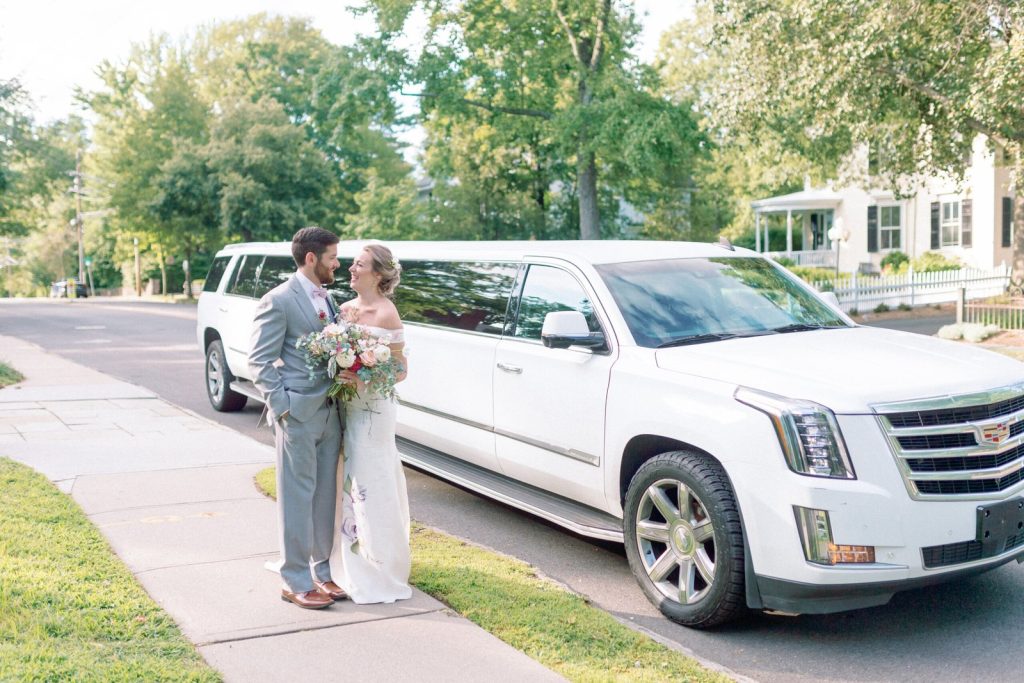 happy bride posing in hand painted silk floral wedding dress