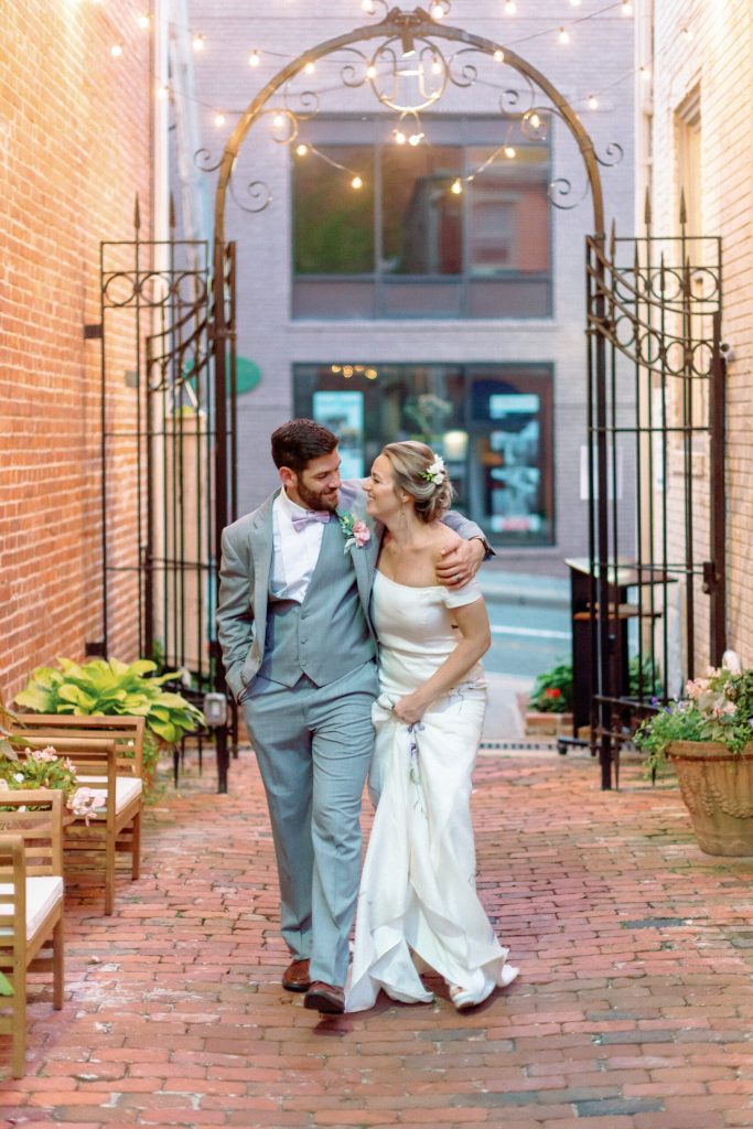 happy bride walking in luxury hand painted bridal gown by ZB Couture