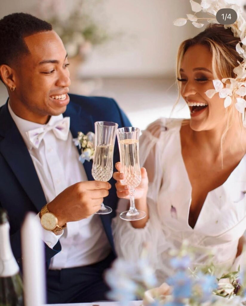 happy couple cheering with their wine glasses